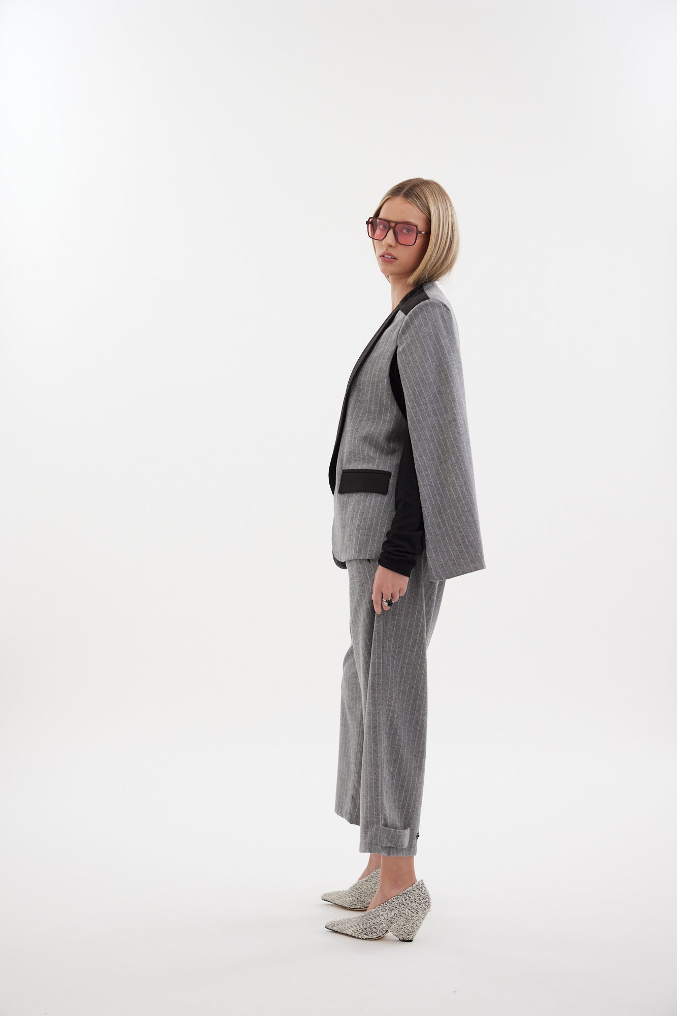 The Siren Cape by Racket - a tailored cape jacket with sleek contrast lapels and subtle shoulder shaping. Style as a suit or with denim. NZ Made.