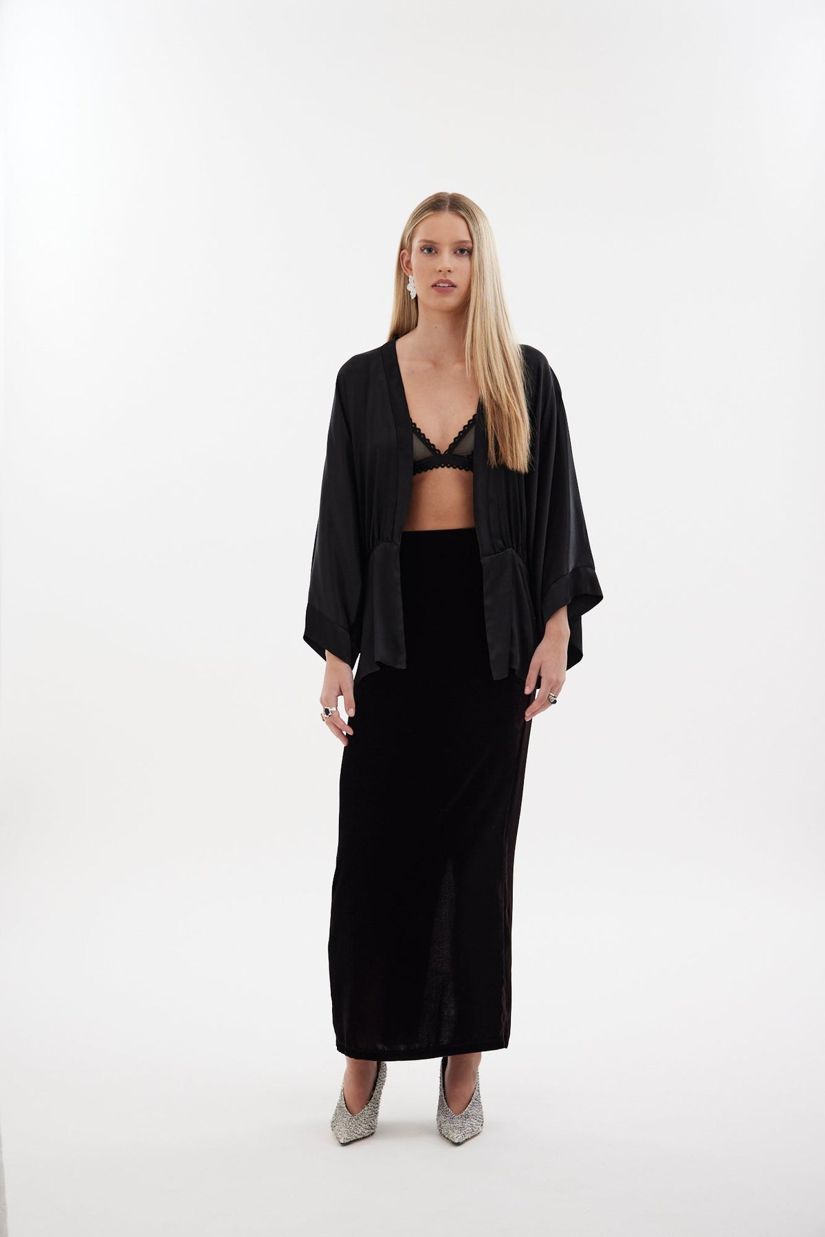 The Vibe Skirt by Racket — a deep plum silk velvet pencil skirt with clean lines and a concealed vent. Elevated evening ease. NZ Made